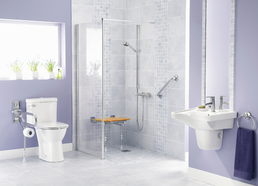 Accessible level access shower bathroom with grab rails, shower seat, and accessible fixtures
