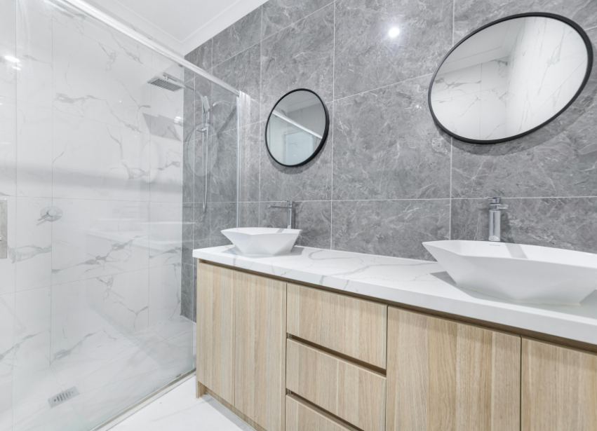 Spacious bathroom installation with double vanity and walk in shower