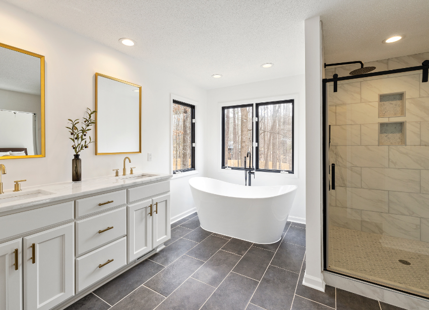 Bright finished bathroom with freestanding bath and shower enclosure
